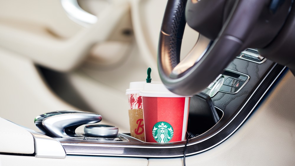car interior with coffee protected with Nanoman car fabric protection